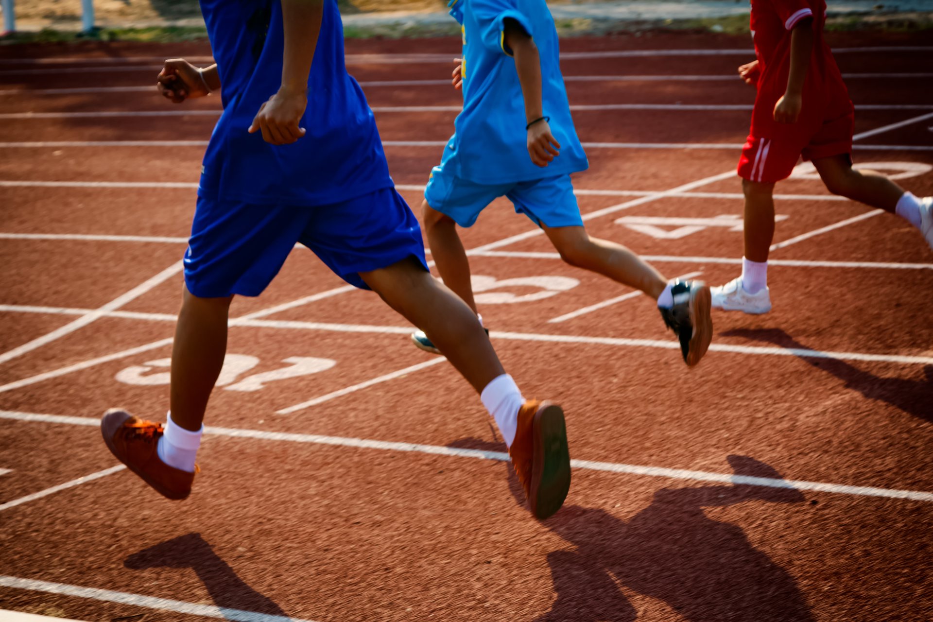 Kids running on a track 