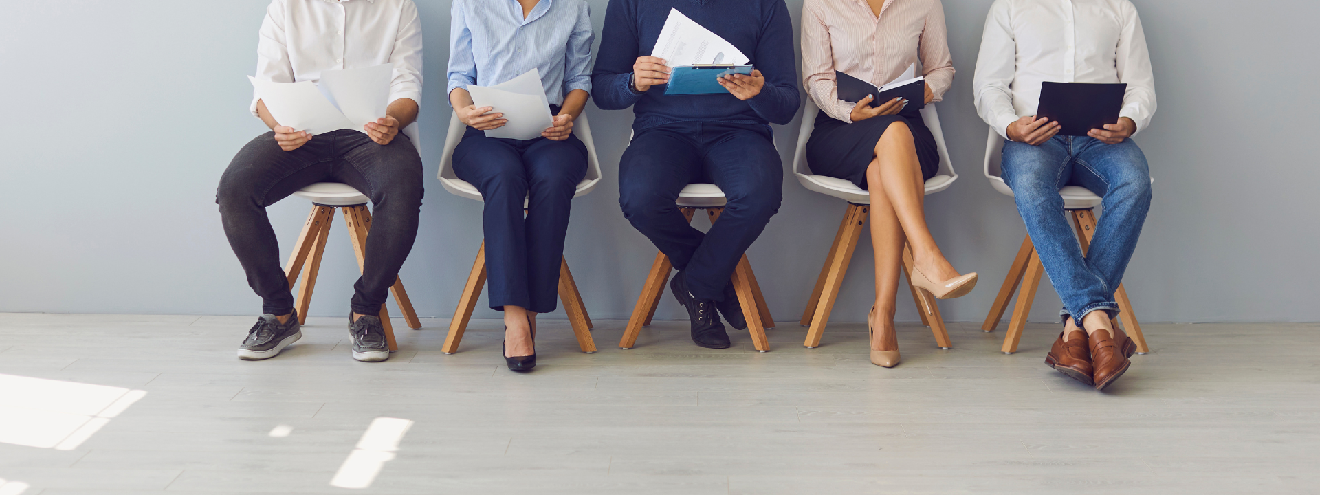 Group of substitute teacher's waiting in line for job interview